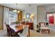Welcoming dining area showcasing a decorative mirror, chandelier, and cozy seating at 5646 Sunset Falls Dr, Apollo Beach, FL 33572
