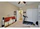 Exercise room showcasing a treadmill and storage, with a partial view of artwork in the foreground at 5646 Sunset Falls Dr, Apollo Beach, FL 33572
