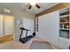 Spacious exercise room featuring a treadmill, ample storage, and a view to the hallway at 5646 Sunset Falls Dr, Apollo Beach, FL 33572