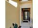 Charming entryway featuring a screen door and decorative accents, including the 'Wise Way' sign at 5646 Sunset Falls Dr, Apollo Beach, FL 33572