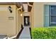 View of the front walkway and entrance to a home featuring neutral colors at 5646 Sunset Falls Dr, Apollo Beach, FL 33572