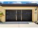 Screened in two-car garage, with ample storage space, and natural light streaming through at 5646 Sunset Falls Dr, Apollo Beach, FL 33572