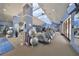 Well-equipped gym featuring modern exercise equipment and ample natural light, perfect for maintaining an active lifestyle at 5646 Sunset Falls Dr, Apollo Beach, FL 33572