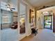 Welcoming hallway with a view into the sitting room and a glimpse of the front entrance at 5646 Sunset Falls Dr, Apollo Beach, FL 33572