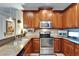 Kitchen featuring stainless steel appliances and a modern backsplash at 5646 Sunset Falls Dr, Apollo Beach, FL 33572