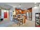 Open kitchen with a breakfast bar, stainless steel appliances, and an adjacent living area at 5646 Sunset Falls Dr, Apollo Beach, FL 33572