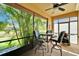 Inviting lanai showcasing serene pond views and comfortable outdoor seating at 5646 Sunset Falls Dr, Apollo Beach, FL 33572