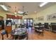 Inviting lounge area featuring tables, chairs, and a coffee station, perfect for socializing or working at 5646 Sunset Falls Dr, Apollo Beach, FL 33572
