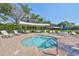 Community hot tub surrounded by tables, chairs, and lounging near covered entertaining areas at 5646 Sunset Falls Dr, Apollo Beach, FL 33572