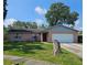 Charming brick home with a well-maintained lawn and mature tree at 603 Southwood Cv, Brandon, FL 33511