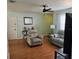 Living room featuring wood-look flooring and comfortable seating at 603 Southwood Cv, Brandon, FL 33511