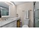 Bathroom features a vanity with granite countertop and a glass enclosed shower at 607 S Albany Ave # 1, Tampa, FL 33606
