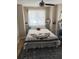 Cozy bedroom with comfortable furnishings and a large area rug at 607 S Albany Ave # 1, Tampa, FL 33606