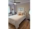 Stylish bedroom features a ceiling fan, modern decor, and hardwood floors at 607 S Albany Ave # 1, Tampa, FL 33606