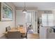 Cozy dining room featuring a modern light fixture, seating for four, and access to the balcony at 607 S Albany Ave # 1, Tampa, FL 33606
