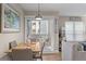 Cozy dining room featuring a modern light fixture, seating for four, and access to the balcony at 607 S Albany Ave # 1, Tampa, FL 33606