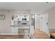 Well-equipped kitchen featuring stainless steel appliances, white cabinetry, and breakfast bar seating at 607 S Albany Ave # 1, Tampa, FL 33606