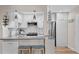 Well-equipped kitchen featuring stainless steel appliances, white cabinetry, and breakfast bar seating at 607 S Albany Ave # 1, Tampa, FL 33606