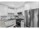 Updated kitchen featuring modern appliances, white cabinets and ample countertop space at 607 S Albany Ave # 1, Tampa, FL 33606