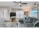 Relaxing living room featuring a comfortable sofa, stylish decor, and lots of natural light at 607 S Albany Ave # 1, Tampa, FL 33606
