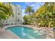 Inviting pool area surrounded by lush tropical landscaping, offering a serene outdoor space at 607 S Albany Ave # 1, Tampa, FL 33606