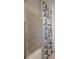 The bathroom features a shower and bathtub with nautical themed shower curtain at 6303 Gentle Ben Cir, Wesley Chapel, FL 33544