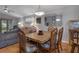 Charming dining room features a wood table, chairs, and a large mirror at 6303 Gentle Ben Cir, Wesley Chapel, FL 33544