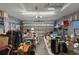 Spacious two car garage featuring ample storage space and overhead lighting at 6303 Gentle Ben Cir, Wesley Chapel, FL 33544