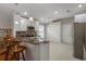 Open-concept kitchen with a breakfast bar and stainless steel appliances at 6303 Gentle Ben Cir, Wesley Chapel, FL 33544