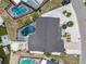 Aerial view showcases the property's roof, pool, and well-maintained landscaping at 6322 Cocoa Ln, Apollo Beach, FL 33572