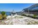 Outdoor backyard featuring boat dock, landscaping, waterfront views, and a pool offering an entertaining and relaxing space at 6322 Cocoa Ln, Apollo Beach, FL 33572