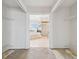 Spacious walk-in closet with white wire shelving and doorway view to primary ensuite bathroom at 6322 Cocoa Ln, Apollo Beach, FL 33572