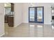 Bright dining area featuring tile floors and French doors leading to outdoor space with water view at 6322 Cocoa Ln, Apollo Beach, FL 33572