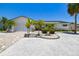 Charming home with brick-paved driveway, manicured landscaping, and a two-car garage at 6322 Cocoa Ln, Apollo Beach, FL 33572