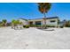 Exterior home showcasing the rock landscaping, and a well manicured yard at 6322 Cocoa Ln, Apollo Beach, FL 33572