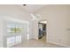 Living area with sleek lighting and views to kitchen and front entry at 6322 Cocoa Ln, Apollo Beach, FL 33572