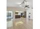 Open concept living space flowing into kitchen with sliding glass door access to patio at 6322 Cocoa Ln, Apollo Beach, FL 33572