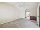 Carpeted main bedroom featuring ceiling fan and en suite bathroom at 6322 Cocoa Ln, Apollo Beach, FL 33572