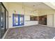 The covered patio features a beautiful tile floor, ceiling fan, and offers transition to the home's indoor spaces at 6322 Cocoa Ln, Apollo Beach, FL 33572