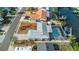 Stunning aerial view of the waterfront property with a screened pool, dock, and well-manicured landscaping at 6508 Senegal Palm Way, Apollo Beach, FL 33572