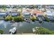 Aerial shot showcases the canal-front home, boat dock, and peaceful waterfront setting, with other neighborhood homes at 6508 Senegal Palm Way, Apollo Beach, FL 33572