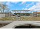 Dockside backyard features screened in pool with patio and grass area at 6508 Senegal Palm Way, Apollo Beach, FL 33572