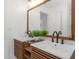 Bathroom features double sink, white countertops, white subway tile in the shower, and wood cabinetry at 6508 Senegal Palm Way, Apollo Beach, FL 33572