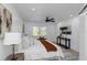 Beautiful bedroom features a large window, ceiling fan, and stylish decor at 6508 Senegal Palm Way, Apollo Beach, FL 33572