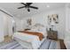 Cozy bedroom with a comfortable bed, stylish decor, and a sliding barn door at 6508 Senegal Palm Way, Apollo Beach, FL 33572