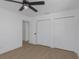 A clean and simple bedroom with laminate floors and three large closets at 6508 Senegal Palm Way, Apollo Beach, FL 33572