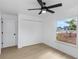 Bedroom featuring white walls, light wood floor, closet and a window with a neighborhood view at 6508 Senegal Palm Way, Apollo Beach, FL 33572