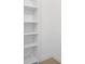 Bright walk-in closet with white shelving at 6508 Senegal Palm Way, Apollo Beach, FL 33572
