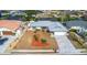 Attractive home boasts a manicured front yard with brick-paved driveway and attached garage, perfect curb appeal at 6508 Senegal Palm Way, Apollo Beach, FL 33572