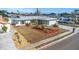 Well-kept front yard with mature landscaping, and a double wide driveway creates a warm and inviting entrance at 6508 Senegal Palm Way, Apollo Beach, FL 33572